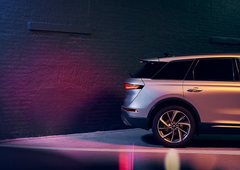 A 2024 Lincoln Corsair® SUV is shown backing up toward a wall. | Purchase Lincoln in Mayfield KY